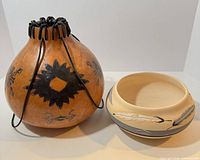 Gourd vessel and Gray Feather bowl side by side
