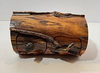 Front view showing carved drawers and branch pulls
