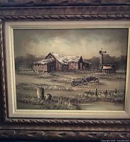 Front view of framed painting showing entire rustic barn scene