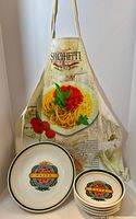 Apron hanging with stacked bowls in front