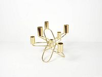 Front angle showing full looping structure and all seven candle cups
