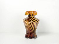 Full front view of striped female torso glass vase