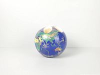 Resin globe with candle wells visible