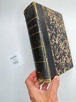 Spine and partial front cover showing leather, gilt title SCHILLER, wear at edges