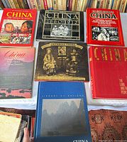 Group shot of all seven hardcover China books