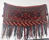 Full view of handwoven Turkmen chuval textile with fringe