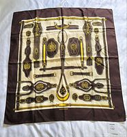 Full view of folded-out Hermès Harnais des Présidents silk scarf showing entire print