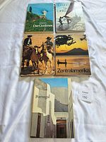 Front view of all five large hardcover books