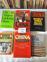 Group shot of all six books laid out front covers visible