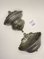 Upper pewter reservoir with brass spigot and detached lower basin
