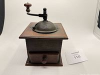 Front view showing wood box, drawer and cast iron top