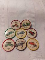 Front view showing all eight Jell-O Wheels with automobile illustrations visible