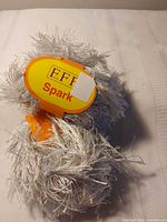 Two EFF Spark yarn balls with label visible