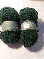 Front view of both yarn balls showing full labels