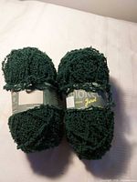 Two balls of dark green Jarol yarn