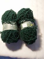 Two green Jarol Explorer yarn balls full view