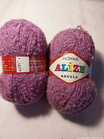 Two lavender balls of Alize Mohair Boucle yarn with labels