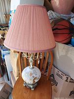 Full view of lamp with pleated pink shade