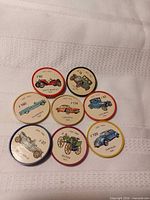 All eight Jell-O wheels face up showing vehicle images and numbers