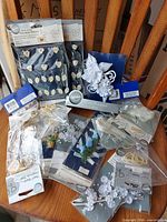 All ten sealed Wilton packages displayed on chair