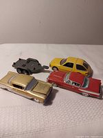 Group view of all four die-cast vehicles