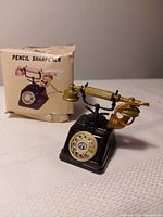 pencil sharpener next to original box