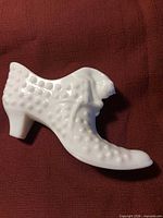 Right side view of white milk glass hobnail shoe