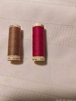 Front view of both Gutermann thread spools showing colours and fullness