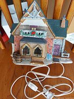 Front view of ceramic house with cord visible