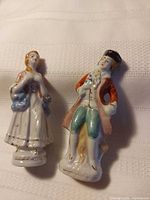 Front view of both Occupied Japan figurines