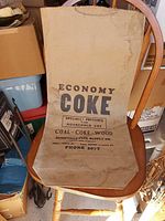 Full view of vintage printed paper bag on chair