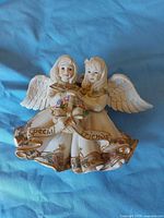 Front view of two-angel resin figurine, ribbon reading Special Friends