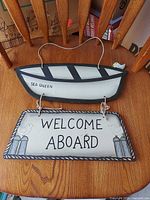 Full view of boat-shaped top and welcome plaque