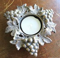 Top view with tealight showing embossed grape and leaf design