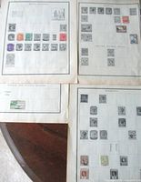 Overview of four album pages on table