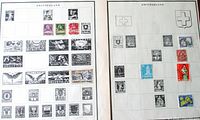 Overview of two Scott album pages filled with Switzerland stamps