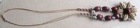 Full view of necklace showing pendant, beads and cord