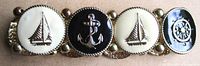 Front view showing enamel medallions with sailboat, anchor and ship wheel motifs