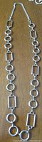 Full view of necklace showing alternating circular and rectangular links
