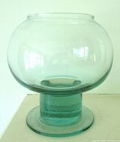 Front view of teal green pedestal vase