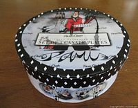 Round Paris Chefs lidded box containing set of plates