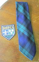 Tie and patch laid out together displaying overall appearance