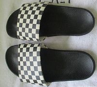 Top view of both sandals showing checkerboard straps and black footbeds