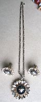 Necklace and earrings full view displaying design and scale