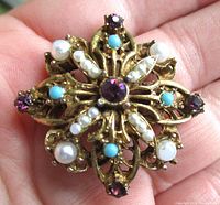 Front view showing gemstones and overall design