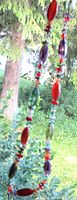 Full view of necklace hanging showing bead colors