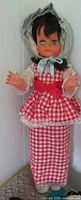 Full view of doll standing showing entire outfit and size reference