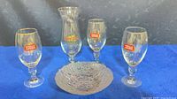 Overall lot showing two Stella goblets, Hard Rock hurricane glass and textured bowl