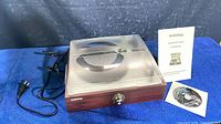 Turntable closed with power cord, manual and software CD
