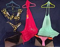Full lot overview with all clothing items on hangers and bikinis displayed